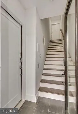 a view of a house with a tree