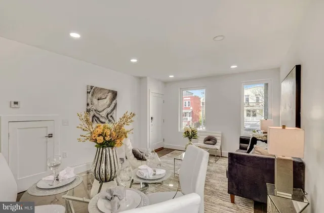 a living room with furniture and a table