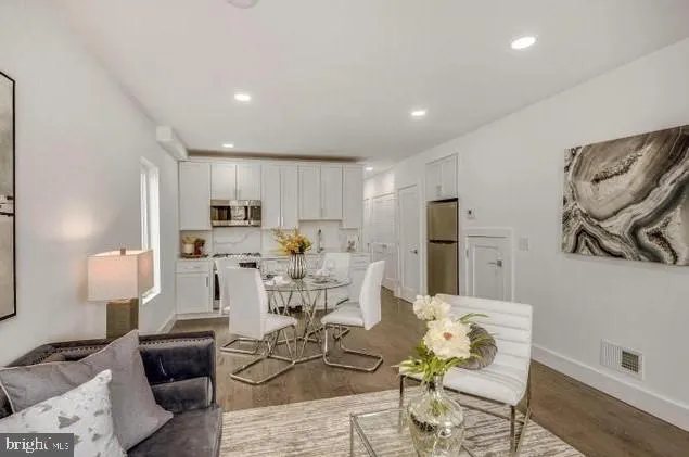 a living room with furniture and a table