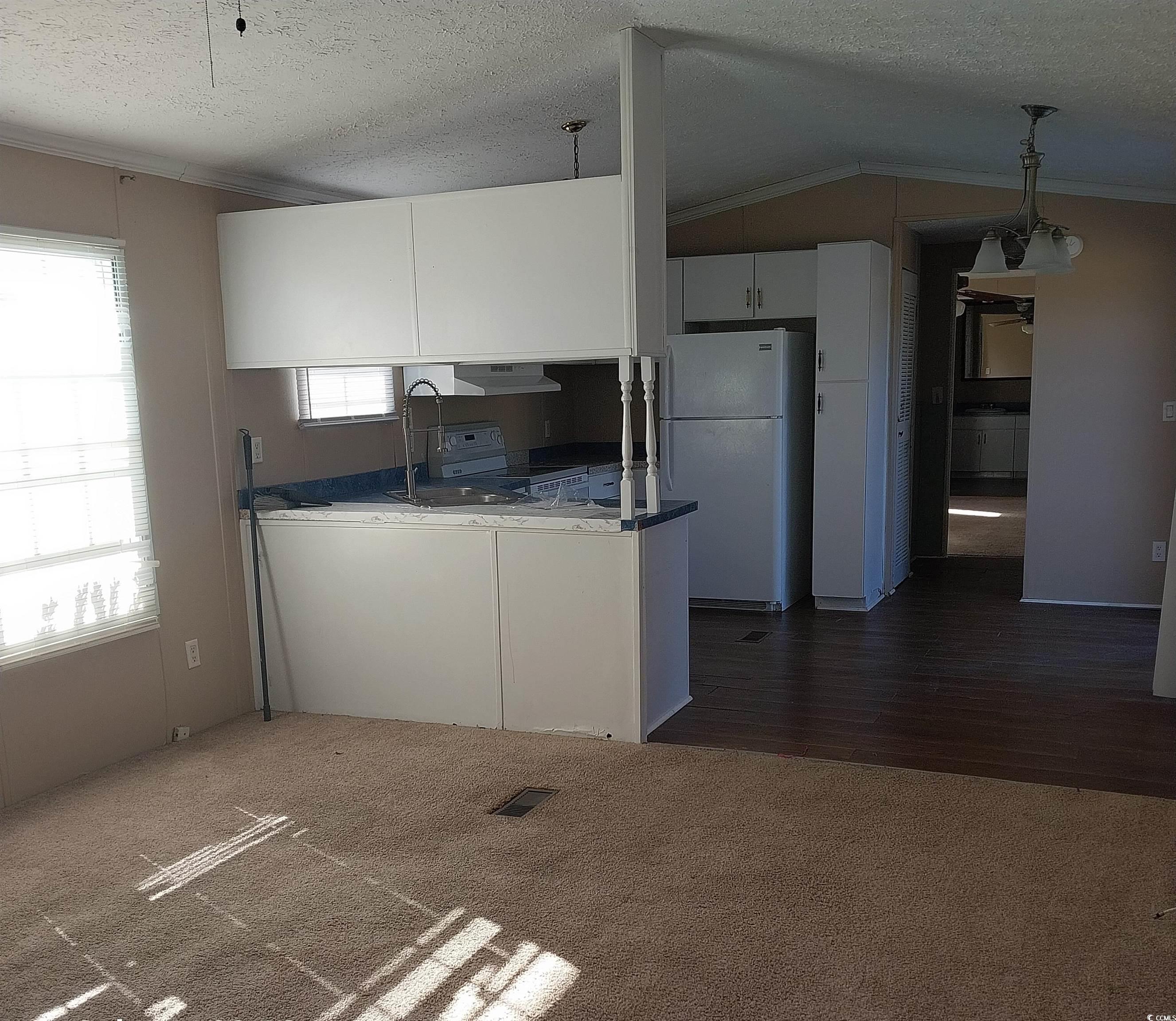 2939 Methodist Rehobeth Road Galivants Ferry, SC 29544 - Photo 15 of 19 Kitchen with pendant lighting, white appliances, w