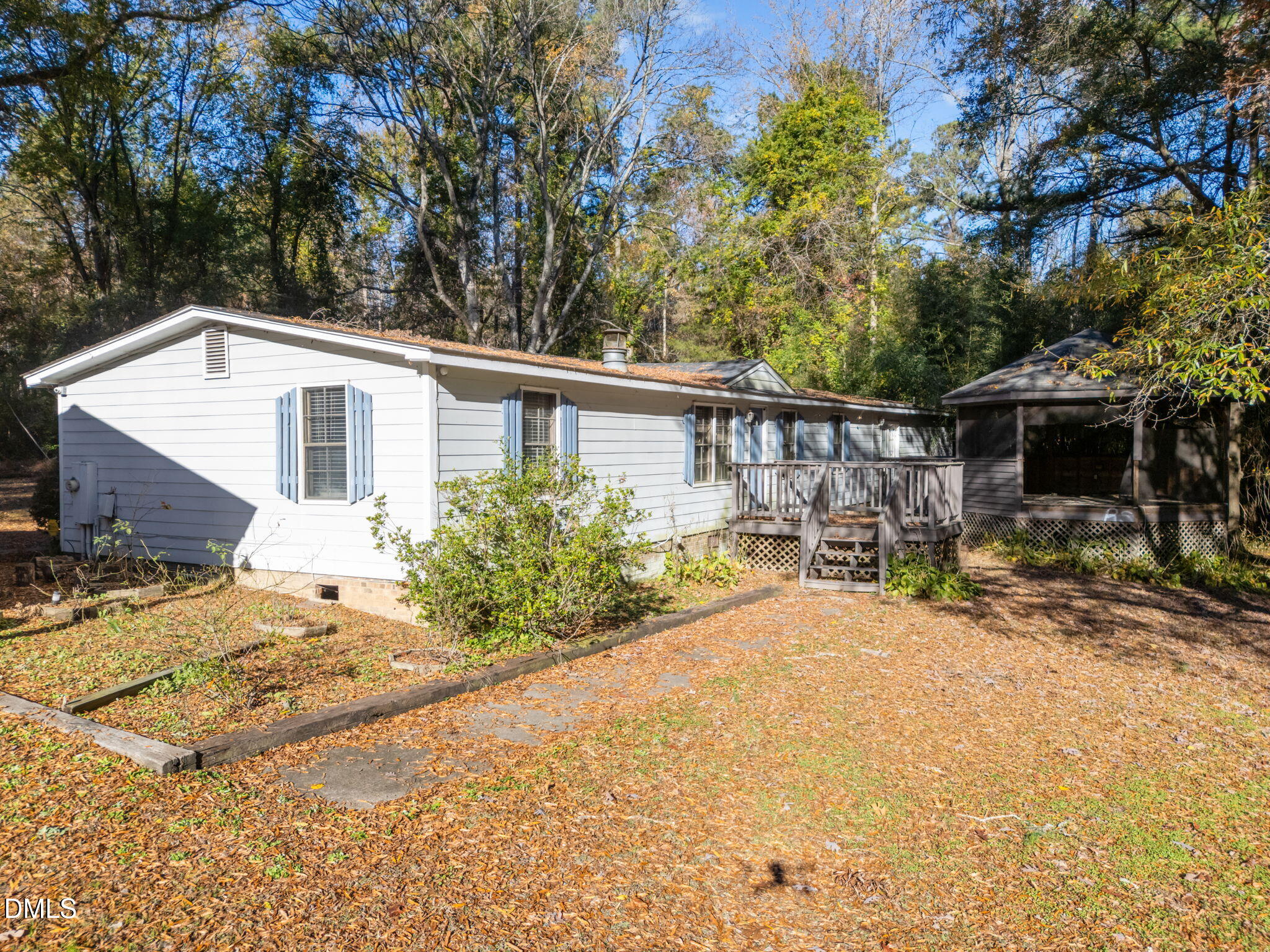 4029 Strickland Farm Road Raleigh, NC 27604 - Photo 13 of 40 a view of a house with backyard and sitting area