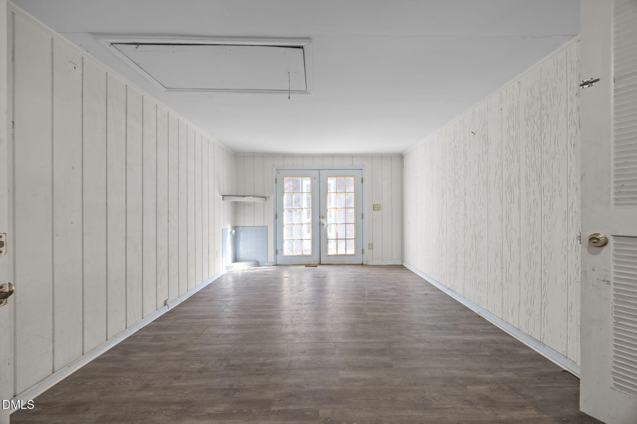 4029 Strickland Farm Road Raleigh, NC 27604 - Photo 25 of 40 a view of an empty room with wooden floor and a window