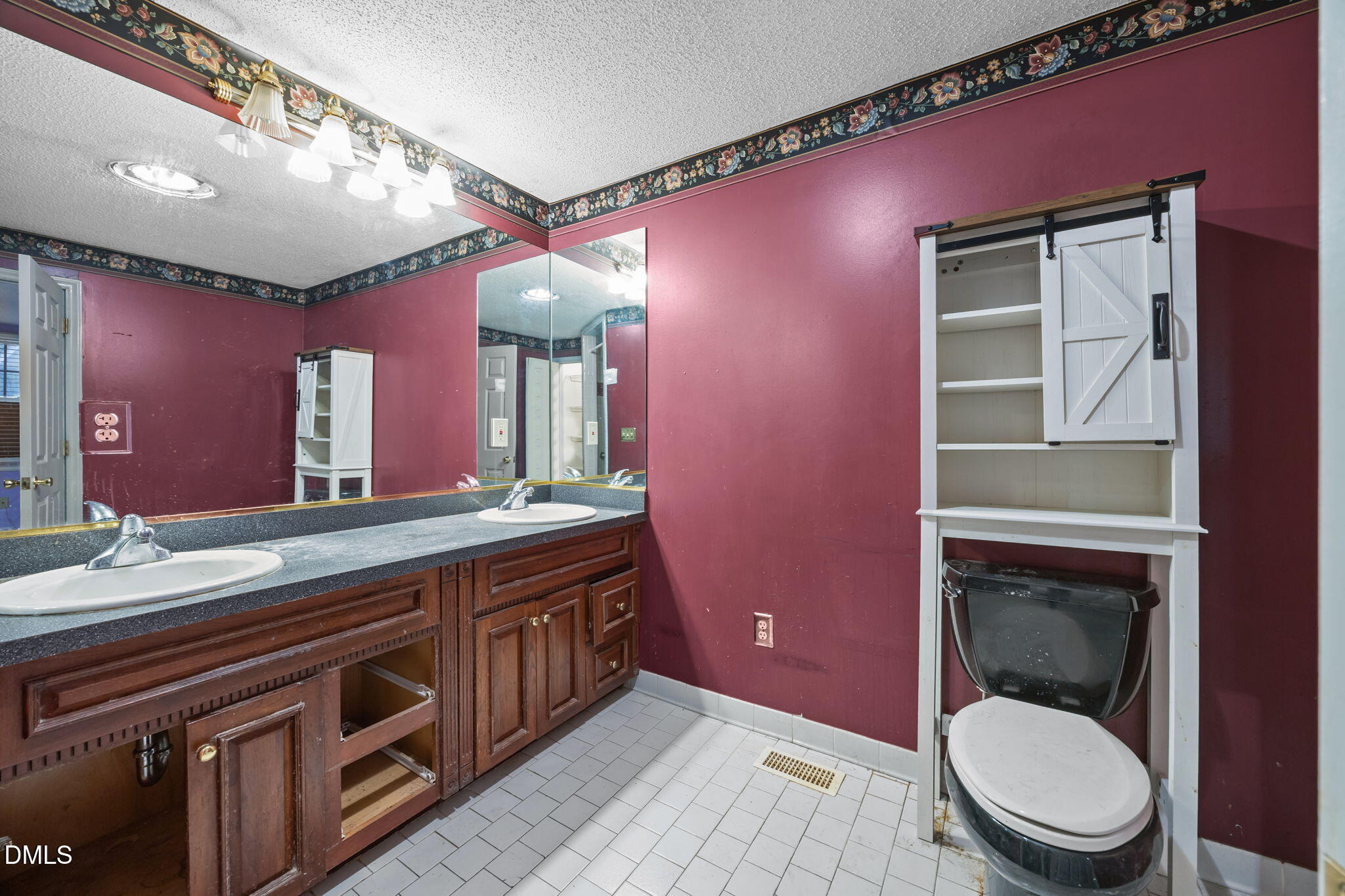 4029 Strickland Farm Road Raleigh, NC 27604 - Photo 29 of 40 a spacious bathroom with a granite countertop toilet a sink and a mirror