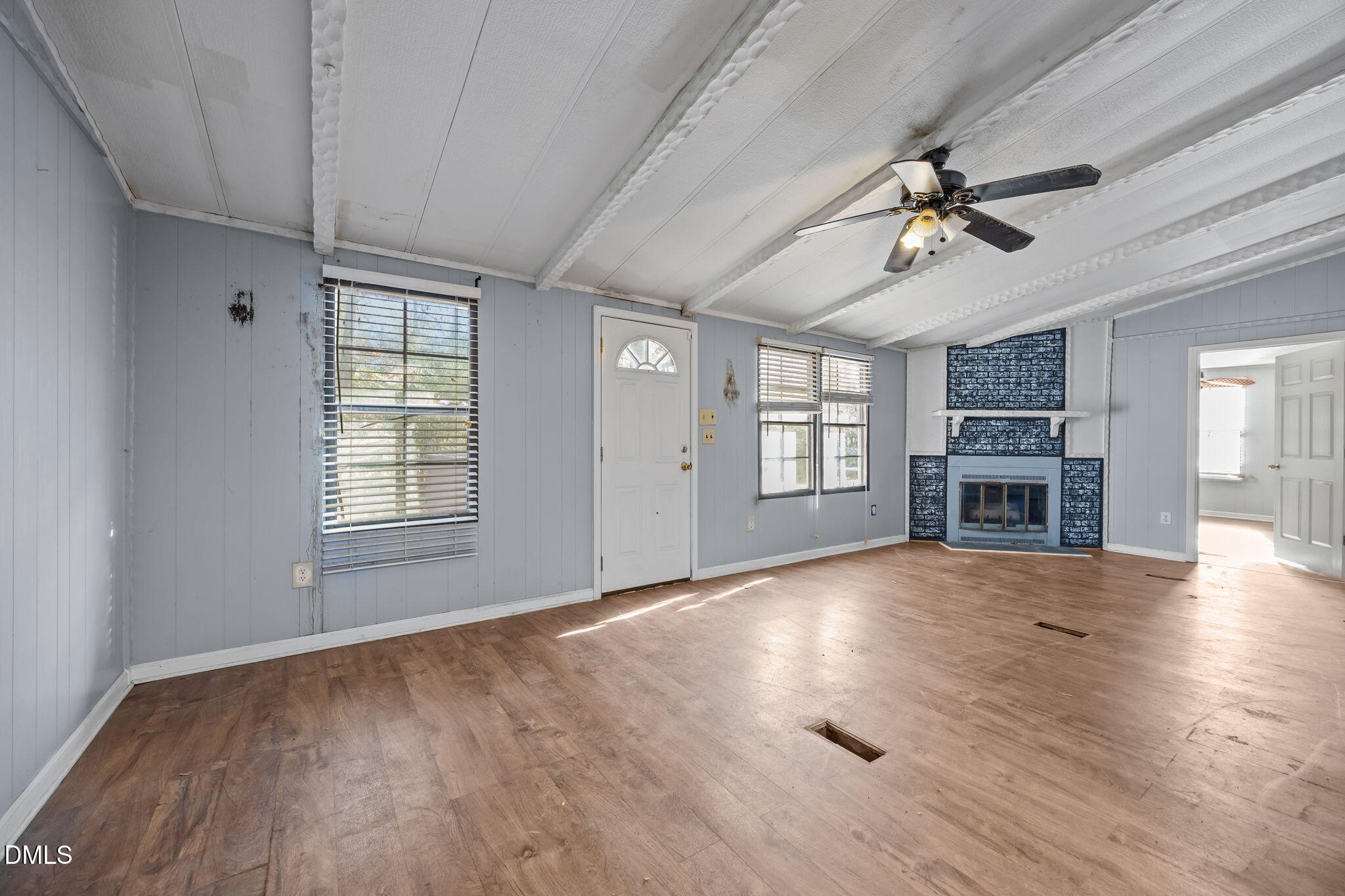 4029 Strickland Farm Road Raleigh, NC 27604 - Photo 34 of 40 a view of an empty room with a window and fireplace