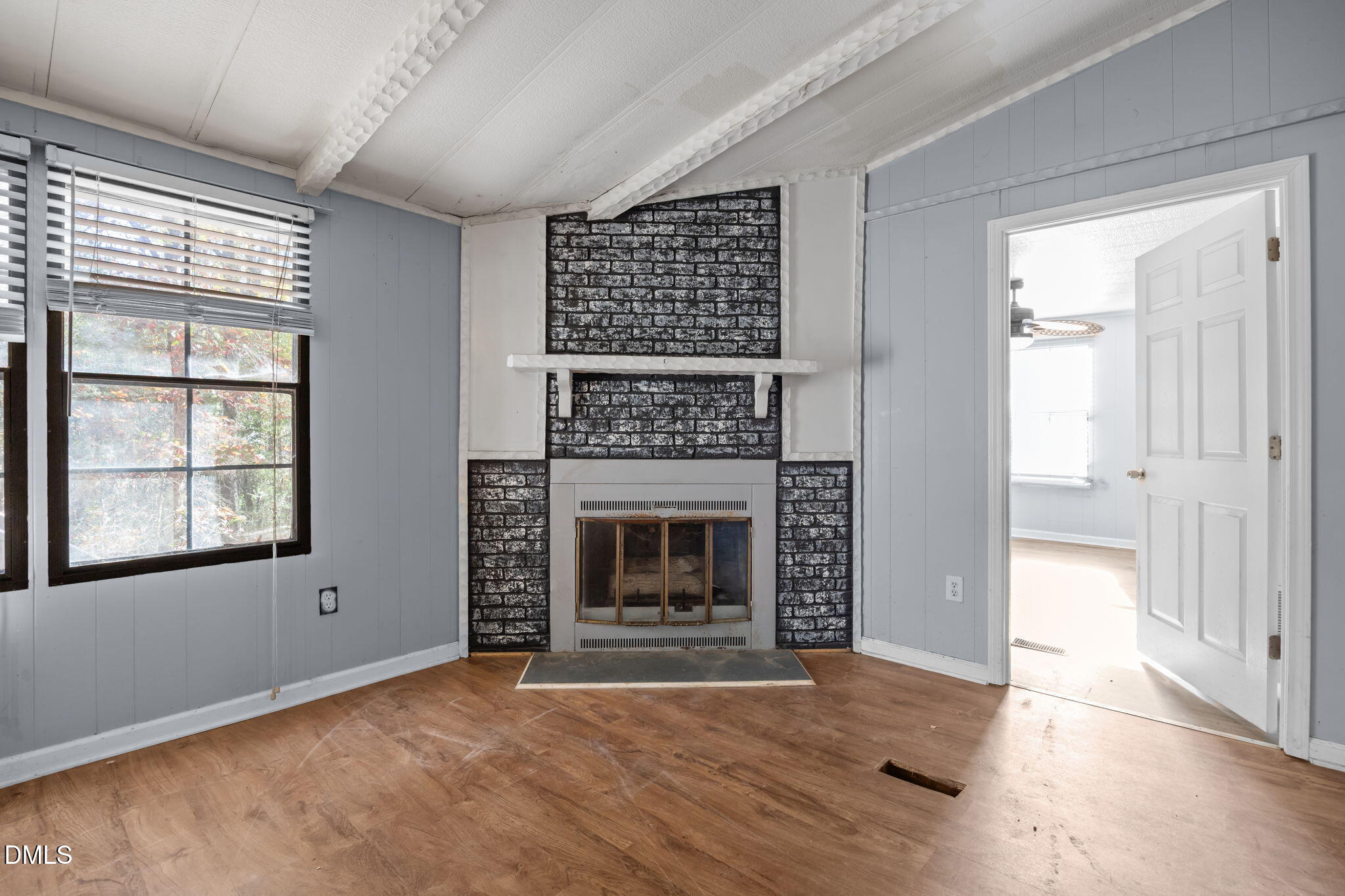 4029 Strickland Farm Road Raleigh, NC 27604 - Photo 37 of 40 a view of an empty room with a window and fireplace