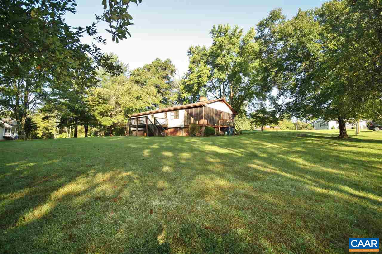65 Gladiola Road Ruckersville, VA 22968 - Photo 16 of 19 a backyard of a house with lots of green space