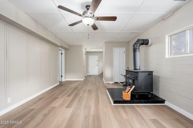 a room with a table and a fireplace