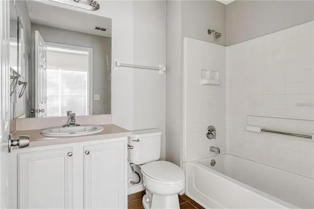 a bathroom with a sink toilet tub and shower