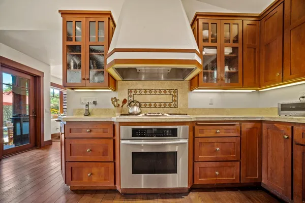 a kitchen with a stove and a cabinet