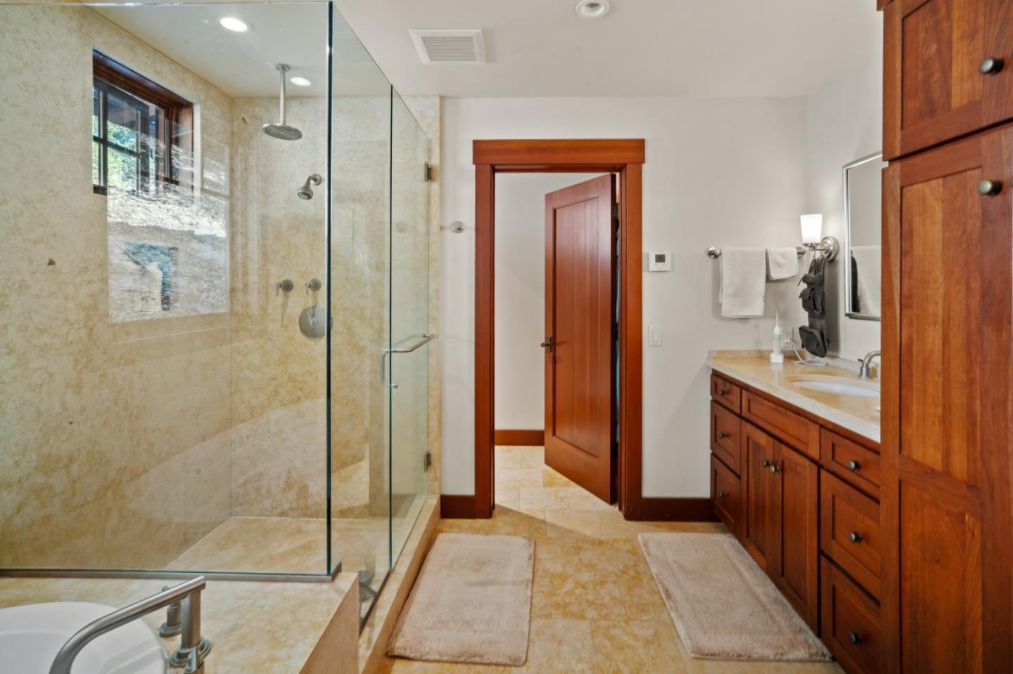 43 Rancho San Carlos Road Carmel, CA 93923 - Photo 25 of 51 a bathroom with a granite countertop sink mirror and shower