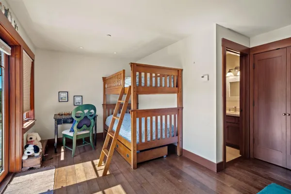 a bedroom with furniture and a window