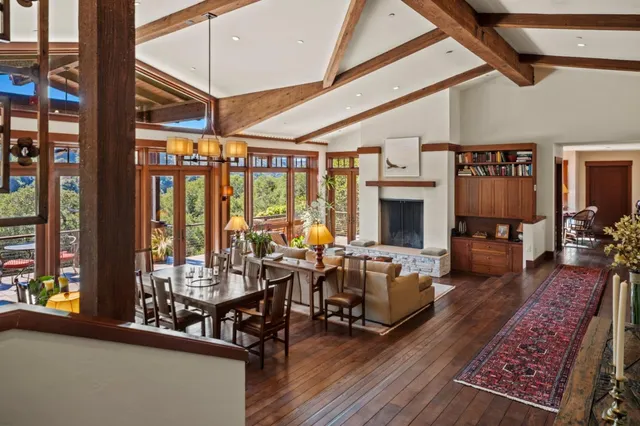 a living room with furniture fireplace and flat screen tv