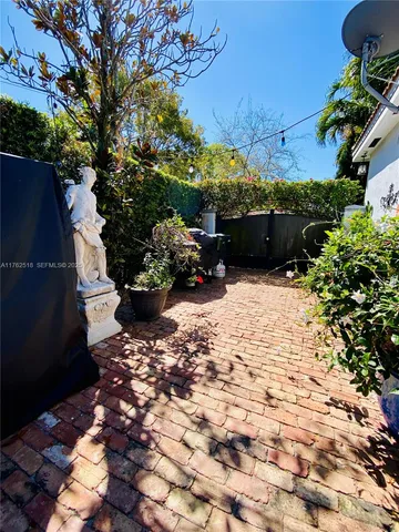 a kitchen with a table and chairs