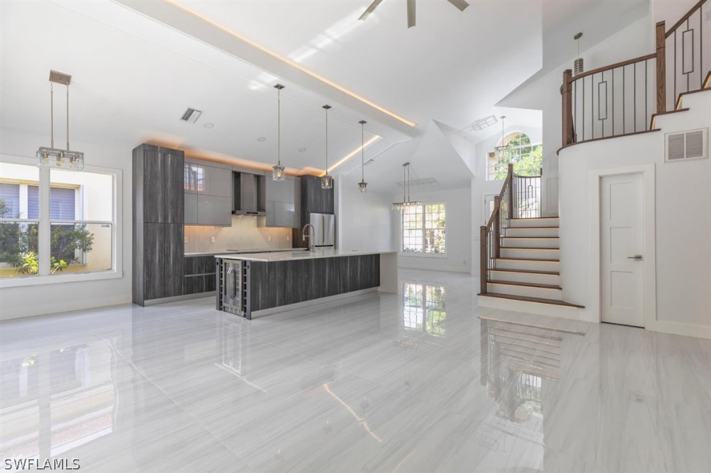 8856 Ventura Way Naples, FL 34109 - Photo 15 of 34 a view of an entryway with wooden floor