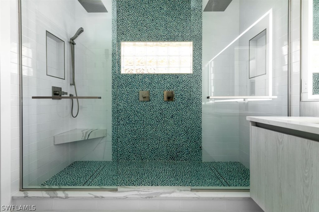 8856 Ventura Way Naples, FL 34109 - Photo 20 of 34 a bathroom with a shower