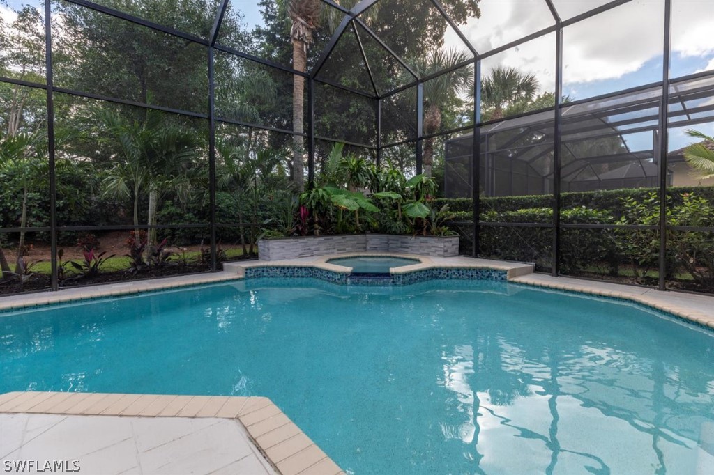 8856 Ventura Way Naples, FL 34109 - Photo 30 of 34 a view of a swimming pool with a patio