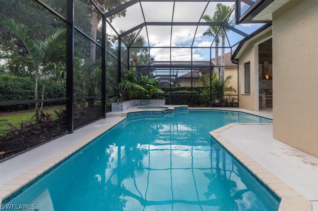 8856 Ventura Way Naples, FL 34109 - Photo 31 of 34 a view of a swimming pool with a patio