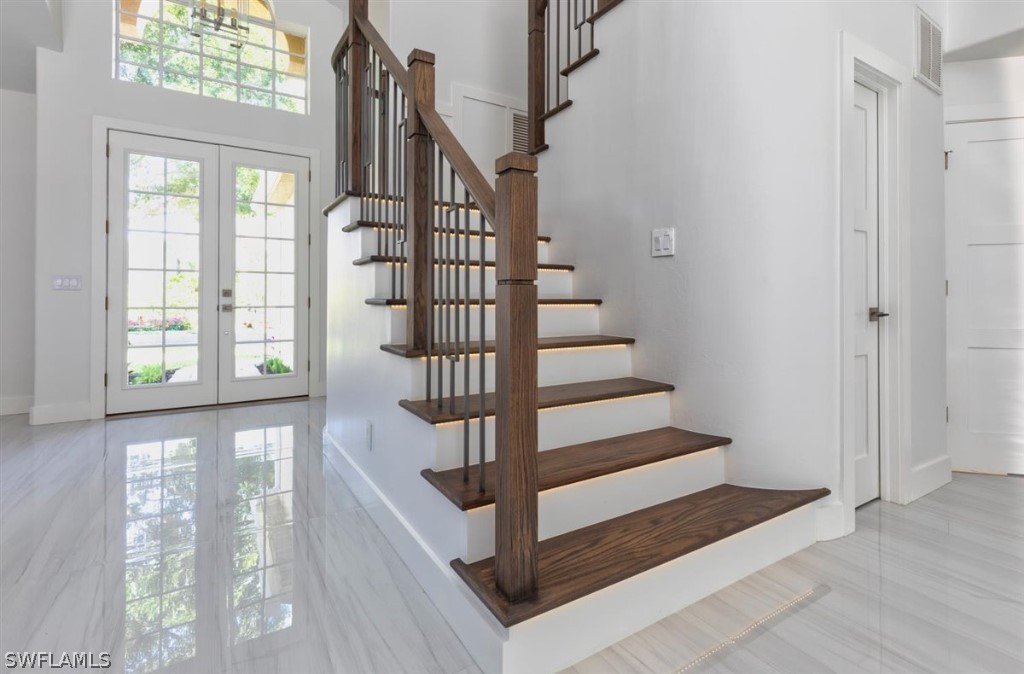 8856 Ventura Way Naples, FL 34109 - Photo 6 of 34 a view of entryway and hall with wooden floor