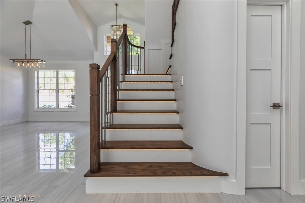 8856 Ventura Way Naples, FL 34109 - Photo 8 of 34 a view of entryway and hall with wooden floor