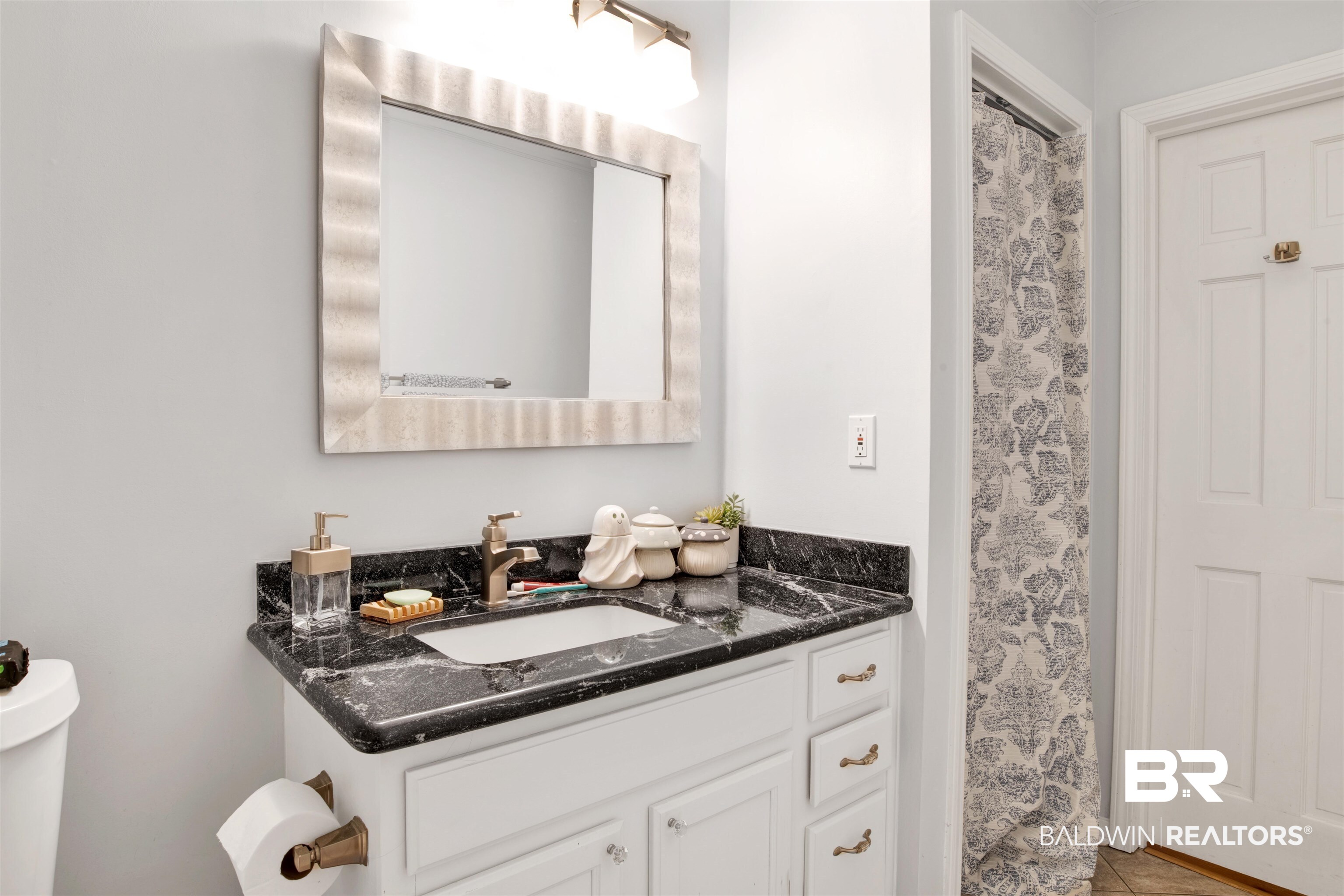605 Van Avenue Daphne, AL 36526 - Photo 17 of 37 Bathroom with vanity, toilet, and tile patterned floors