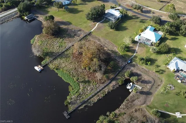 an aerial view of a house with a lake view