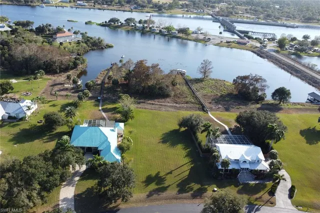 an aerial view of a house with a lake view