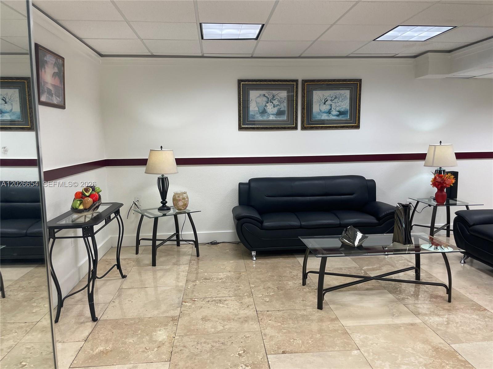 4174 Inverrary Drive, Unit 903 Lauderhill, FL 33319 - Photo 7 of 36 a living room with furniture and a rug