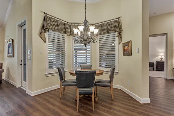 a kitchen with a table and chairs in it