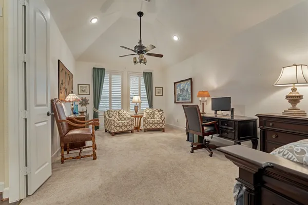 a living room with furniture fireplace and window