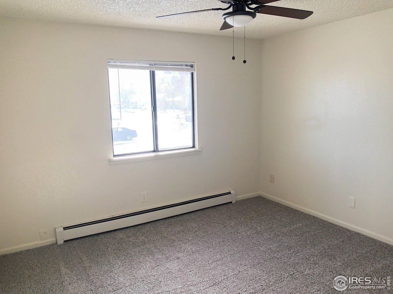 229 15th Street Greeley, CO 80631 - Photo 12 of 19 an empty room with a window