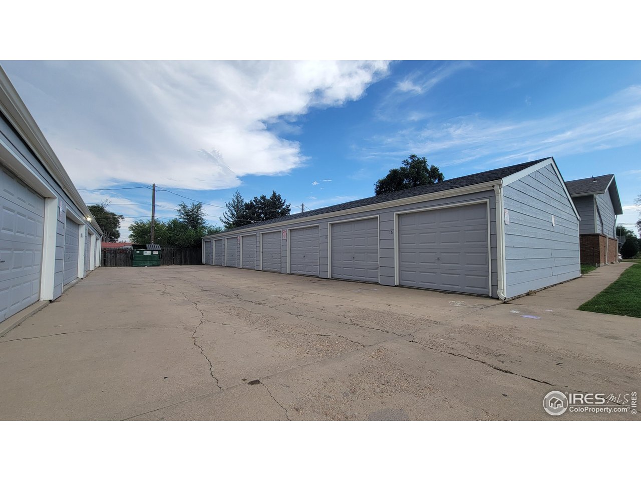 229 15th Street Greeley, CO 80631 - Photo 10 of 19 a black and white photo of a person on a street