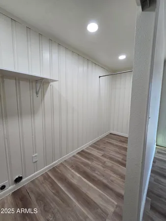 a view of hallway with cabinets