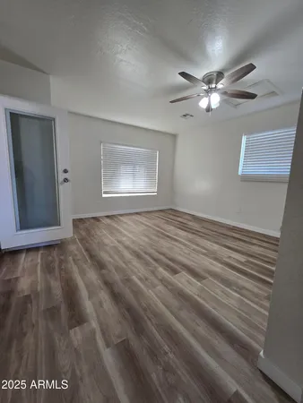 a view of an empty room with a window