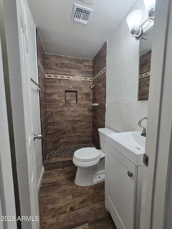 a bathroom with a toilet and a sink