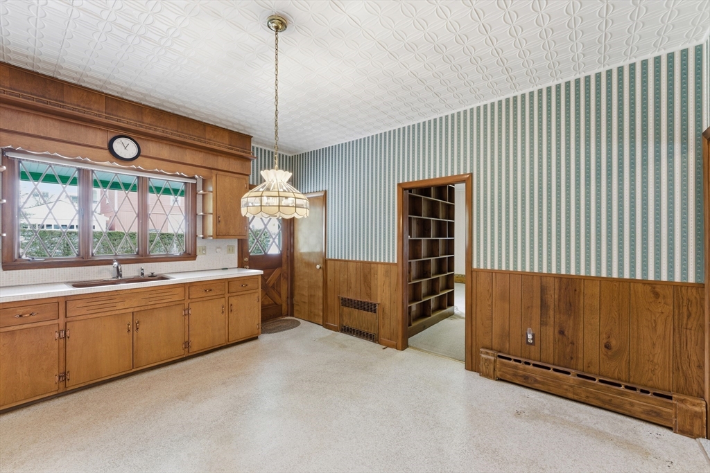 3 River Street Hardwick, MA 01031 - Photo 16 of 36 a spacious bedroom with a balcony a bed and a chandelier