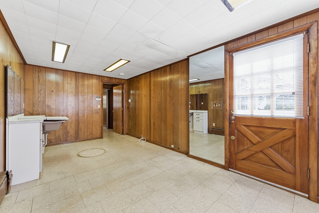 3 River Street Hardwick, MA 01031 - Photo 31 of 36 a view of an empty room with a fireplace and a window