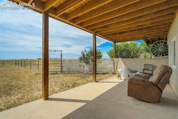 a view of a room with wooden fence