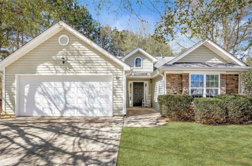 57 Green Spring Newnan, GA 30265 - Photo 1 of 1 a front view of a house with a garden