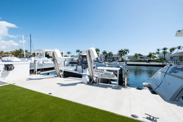 a view of backyard with a table and chairs under an umbrella