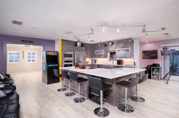a bathroom with a sink toilet and mirror