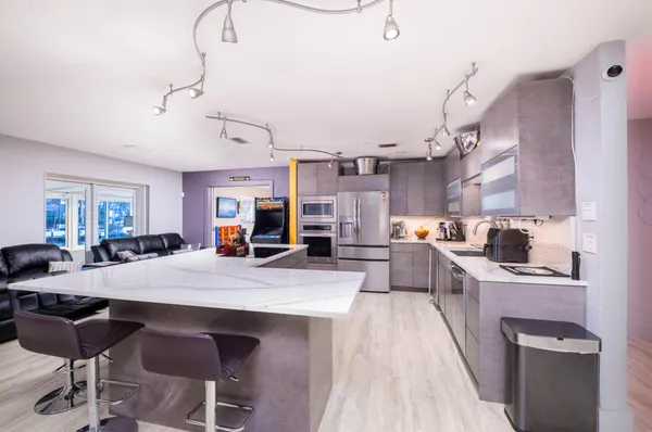 a bed room with a bed and a large mirror