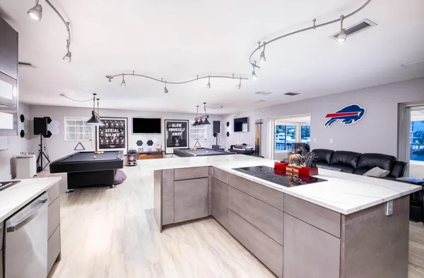 a room with gym equipment and view of living room