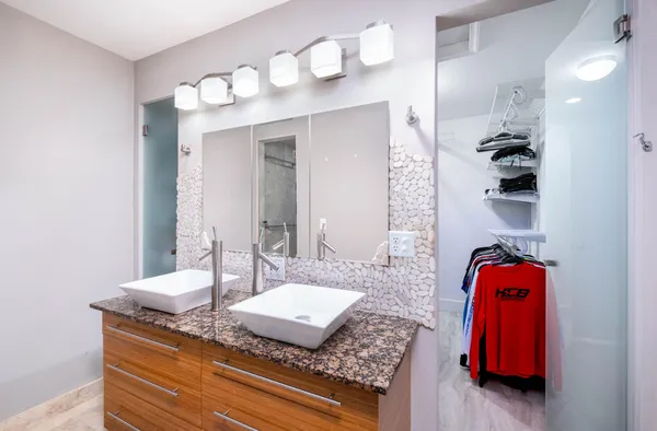 a utility room with sink dryer and washer