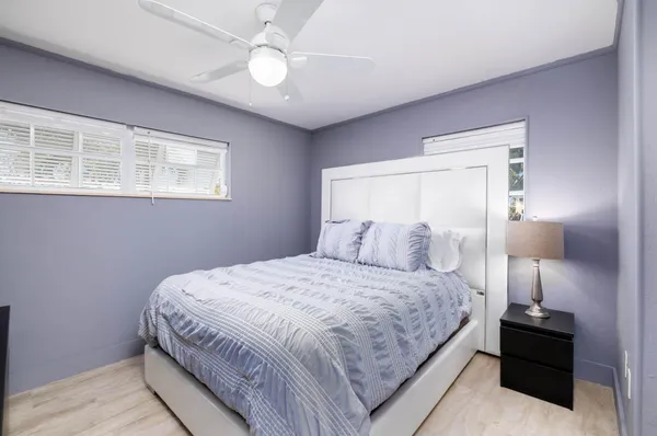 an aerial view of a house with a garden swimming pool and outdoor seating