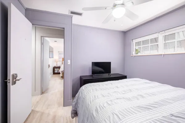 an aerial view of a house a yard swimming pool a table and chairs