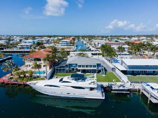a view of a lake with boats and trees in the background