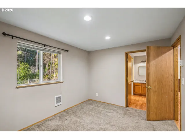 a view of an empty room with a window