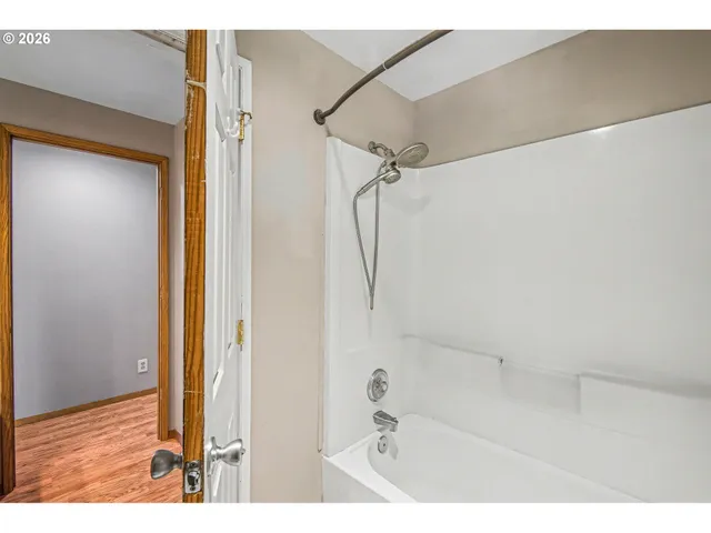 a bathroom with a glass shower door