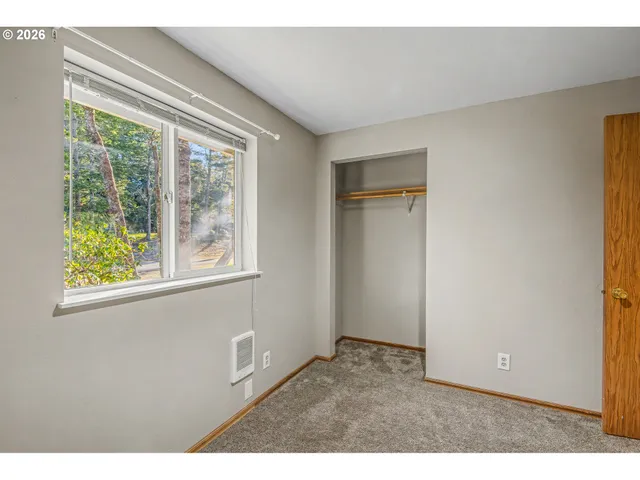 a room with windows and closet