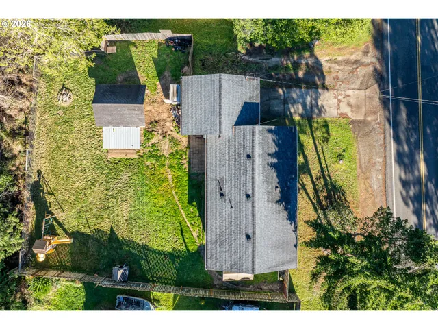 an aerial view of a house with yard swimming pool and outdoor seating